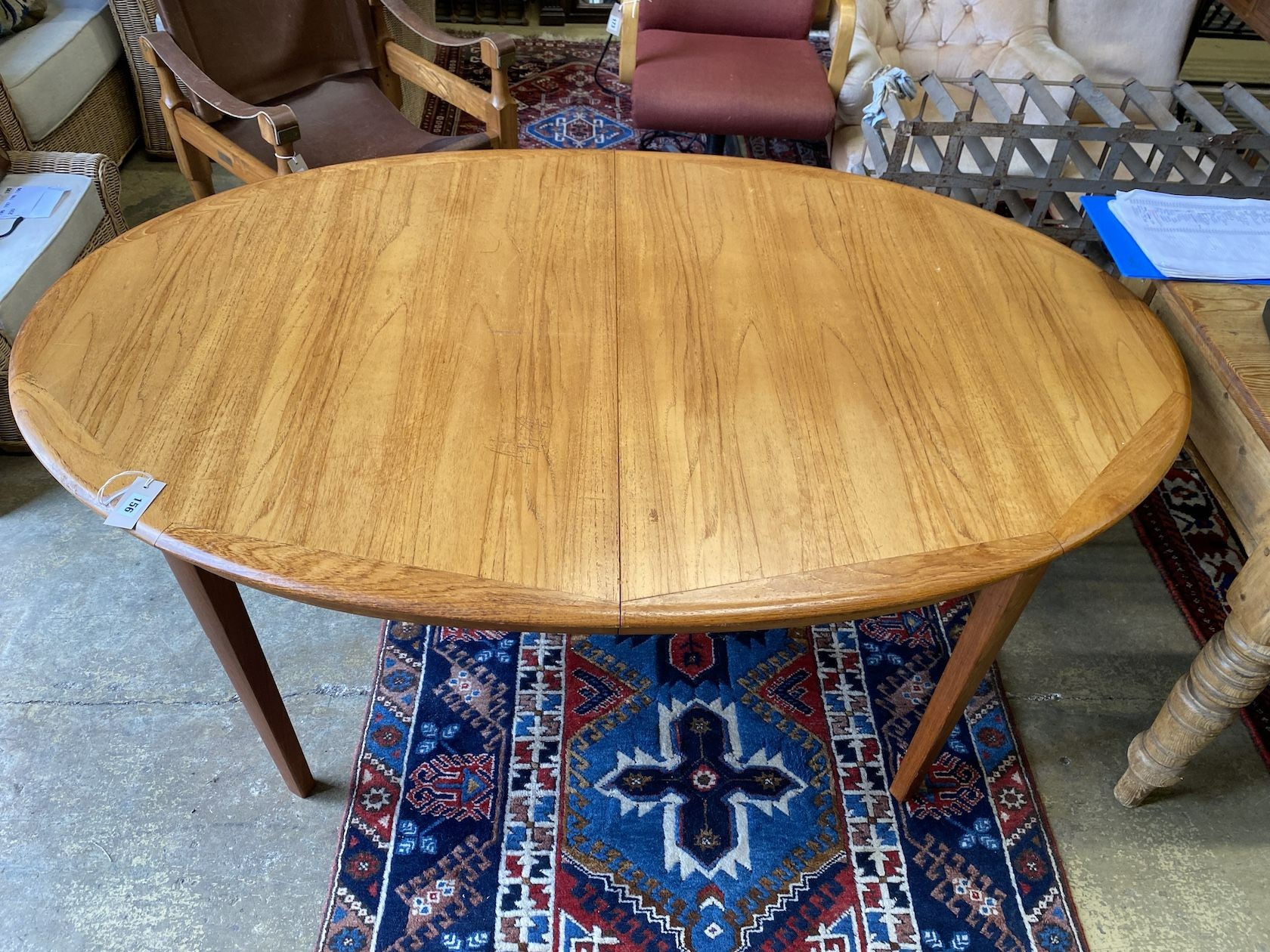 A mid century Drylund teak oval extending dining table, 220cm extended, depth 100cm, height 72cm